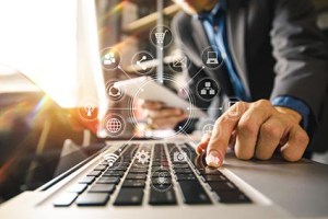 businessman hand working with laptop computer, tablet and smart